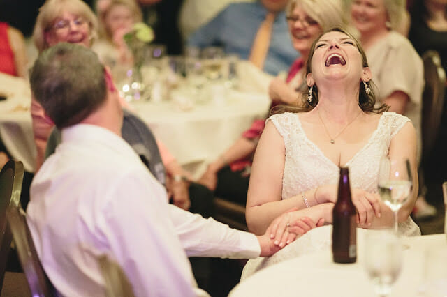 Bride laughing in Wedding Reception